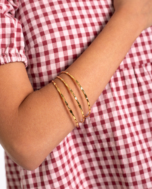 PACK 3 BRAZALETES PROTECTION · BAÑO ORO